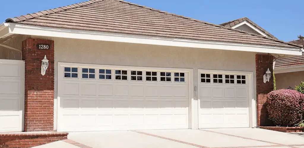 Residential garage door repair service for a double garage door in Fort Wayne, IN