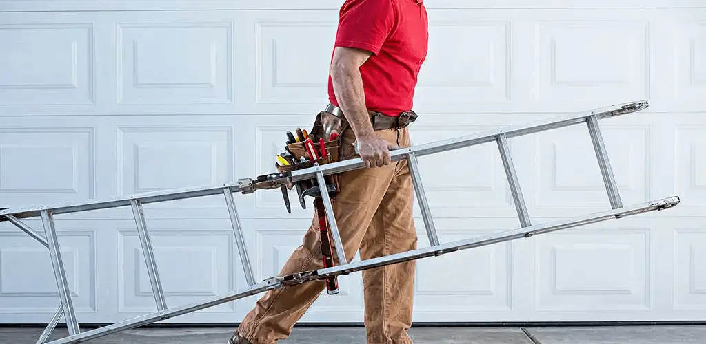 Garage door repair technician arriving with tools and ladder in Fort Wayne, IN