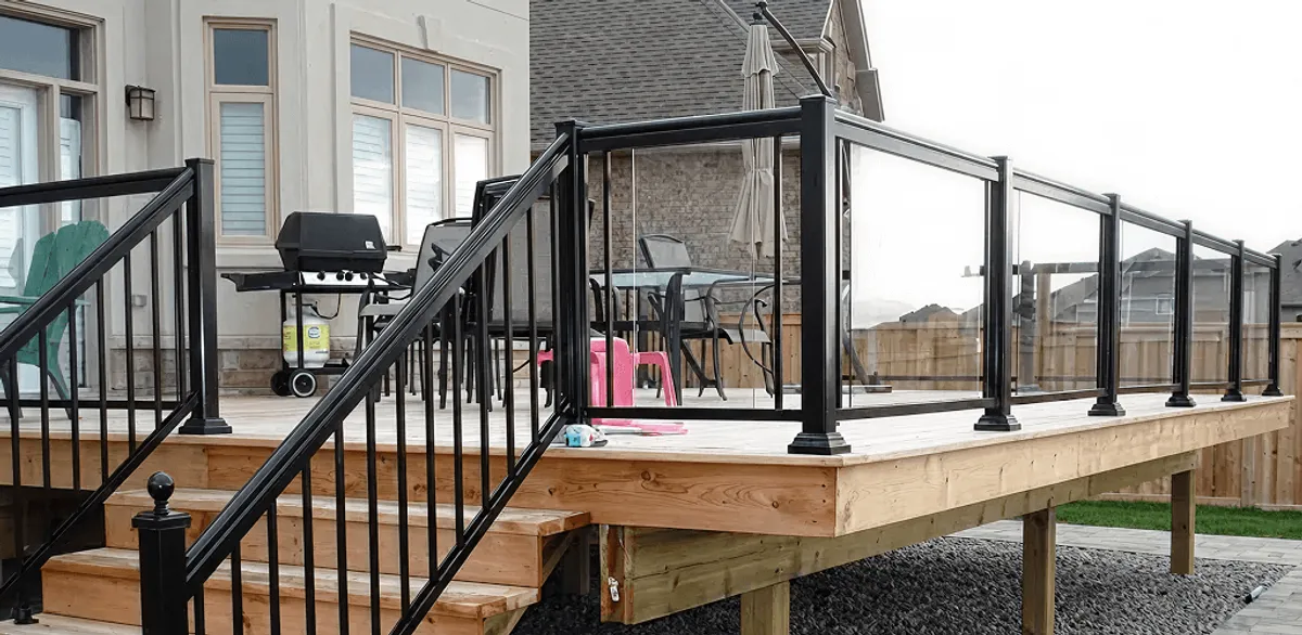 Handrail installation on a deck staircase for safety and code compliance in Fort Wayne, IN