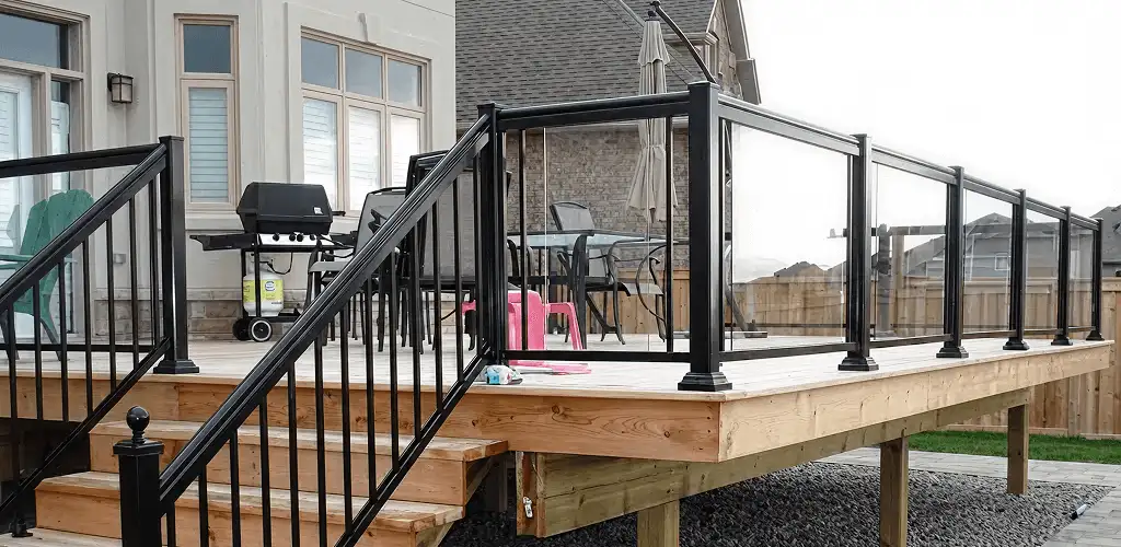 Handrail installation on a deck staircase for safety and code compliance in Fort Wayne, IN