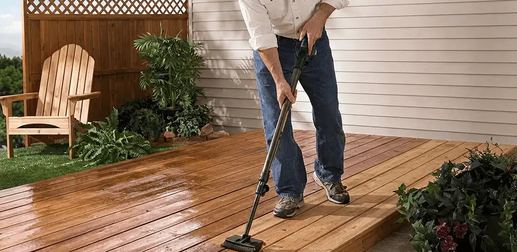 Deck staining service applying stain to a backyard wood deck in Fort Wayne, IN
